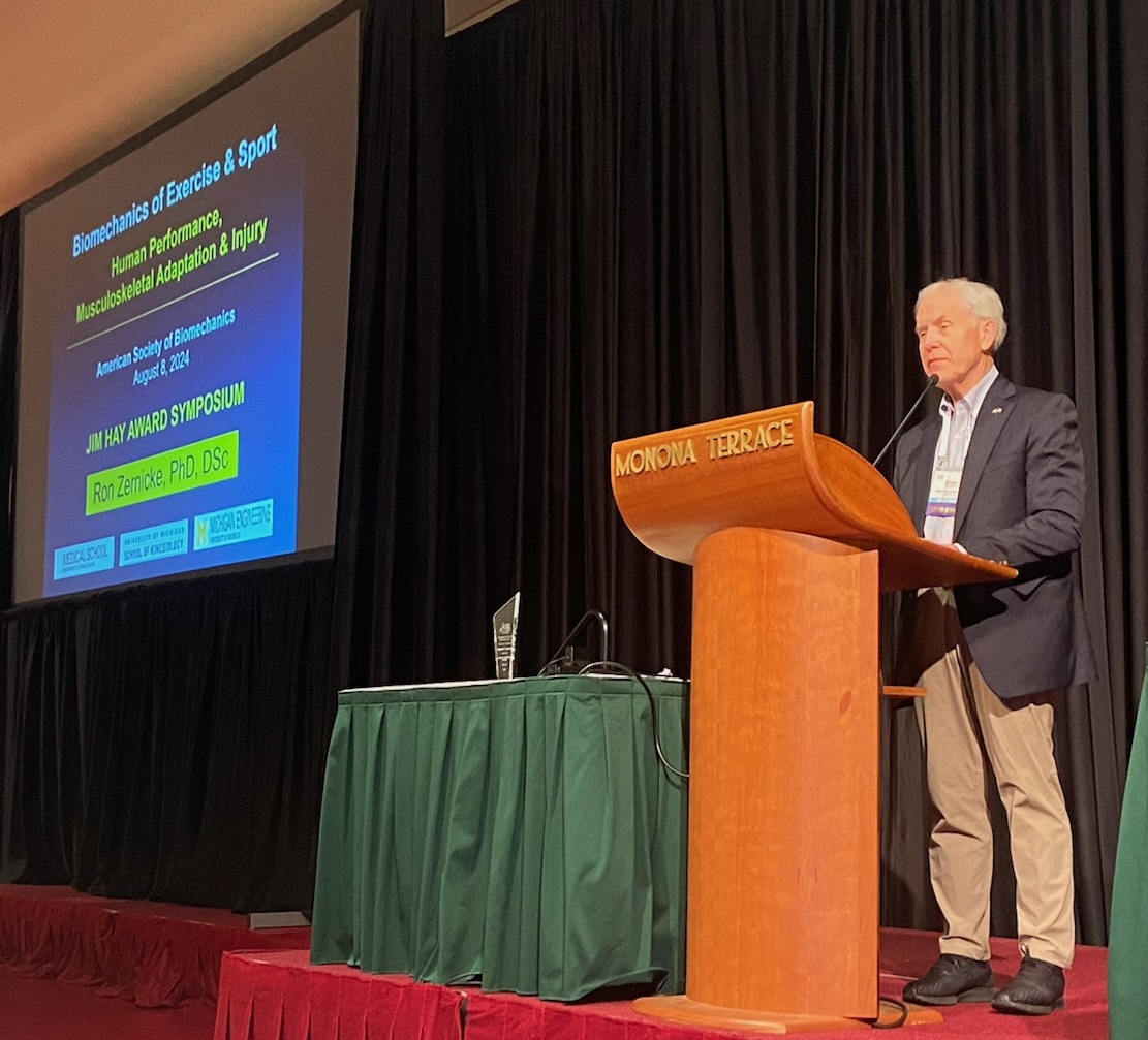 Dr. Ken Kozloff presenting at a conference